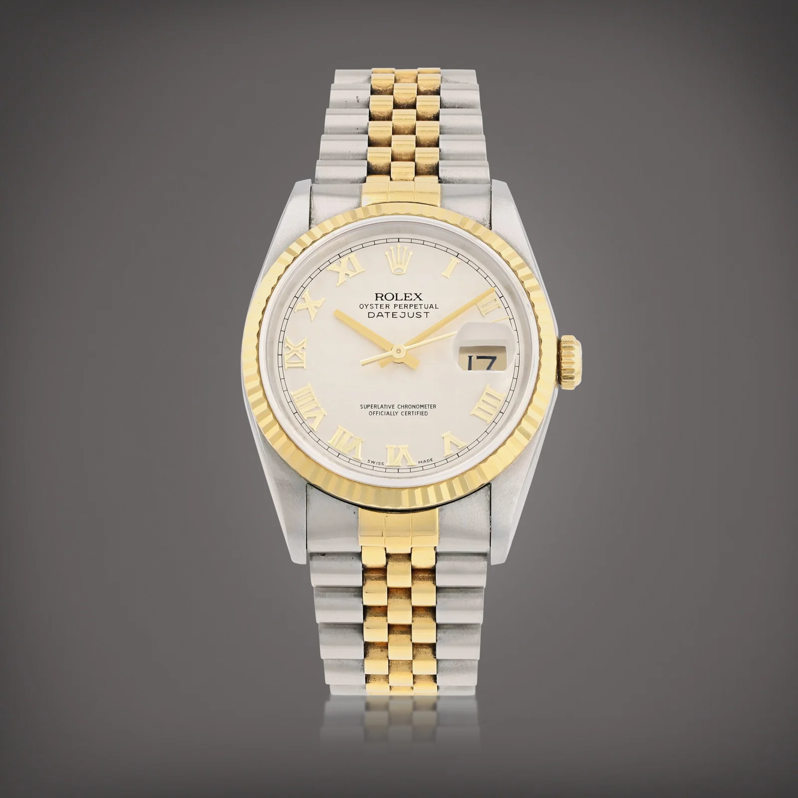 Rolex Datejust 16233 with a white Roman-numeral dial, fluted yellow-gold bezel, and Jubilee bracelet