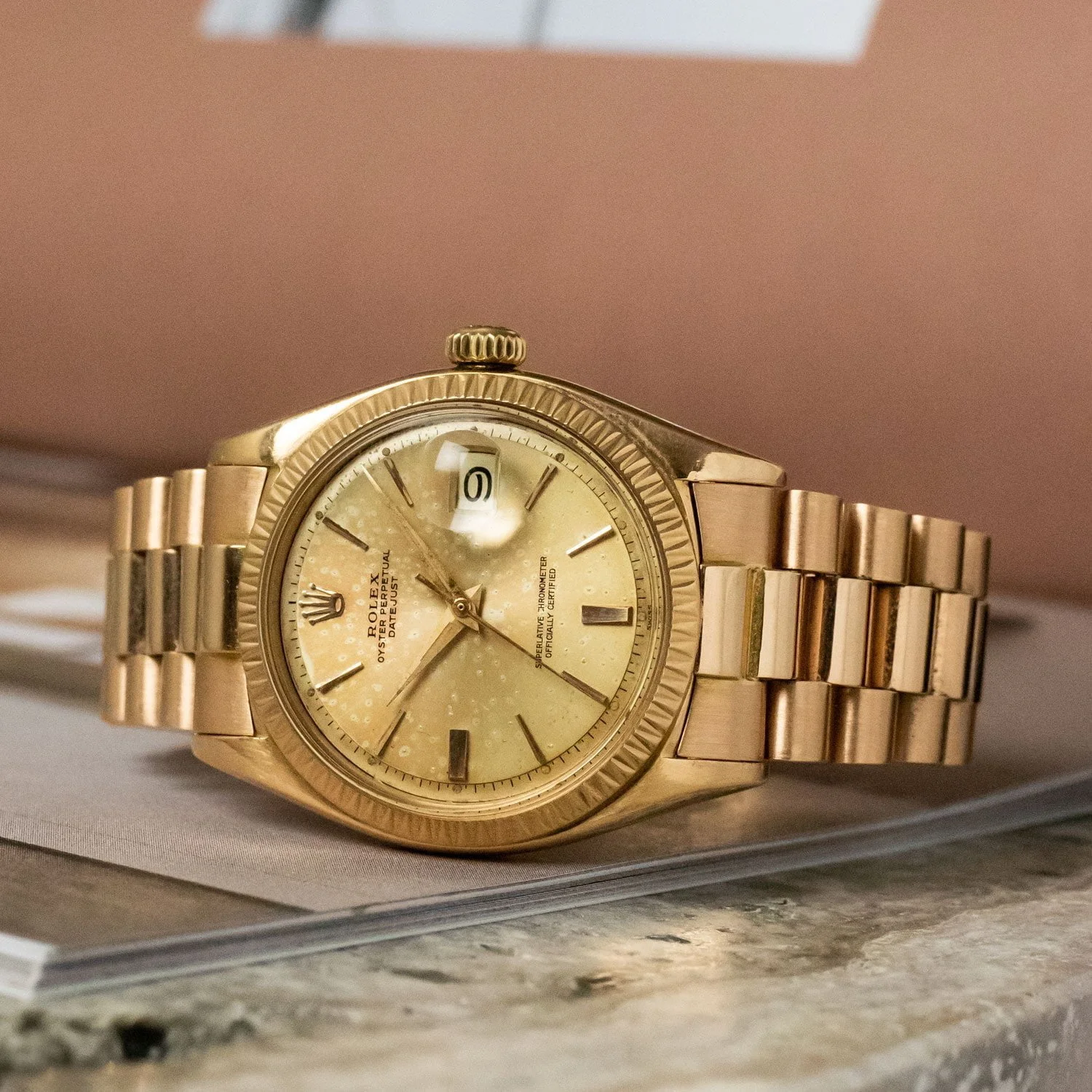 Rose-gold Datejust sold as reference 1605, with a triangular-cut bezel