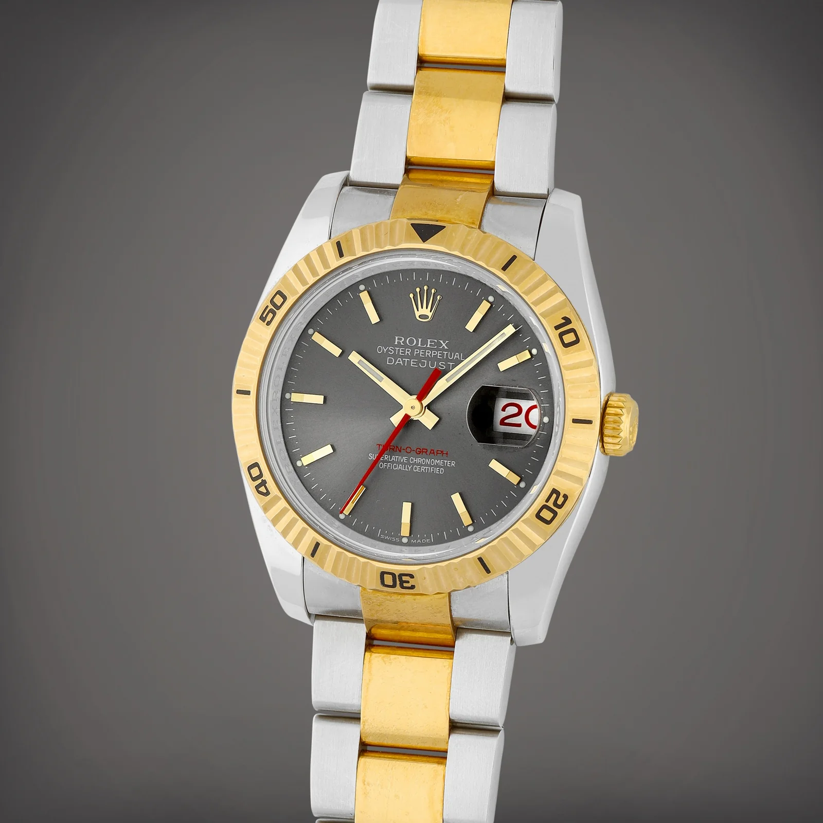 Grey dial with red seconds hand, red date numeral and red Turn-O-Graph text on a Rolex 116263