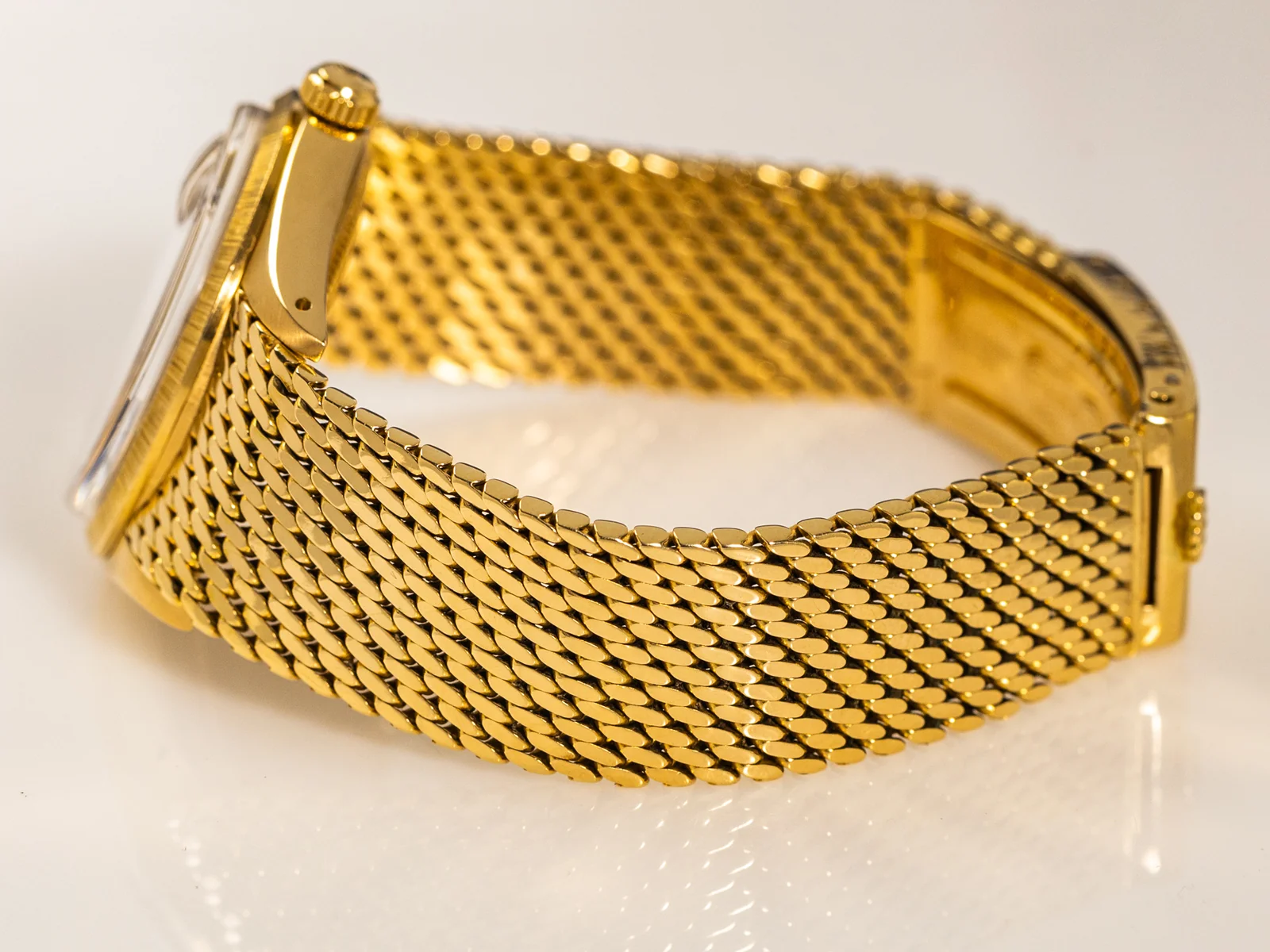 Gold mesh bracelet shown with the Bachmann & Scher watch