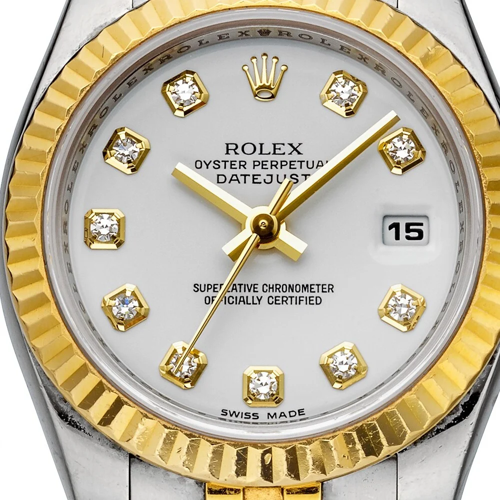 Close view of the 179173 dial, showing diamond indexes, date window and dial printing.