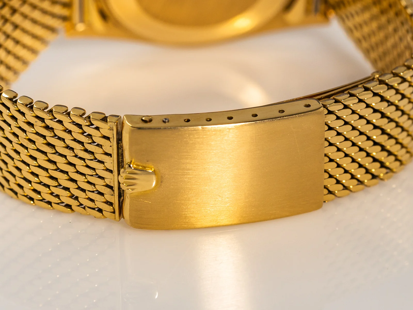 Reverse of the gold bracelet clasp; no date code is identified