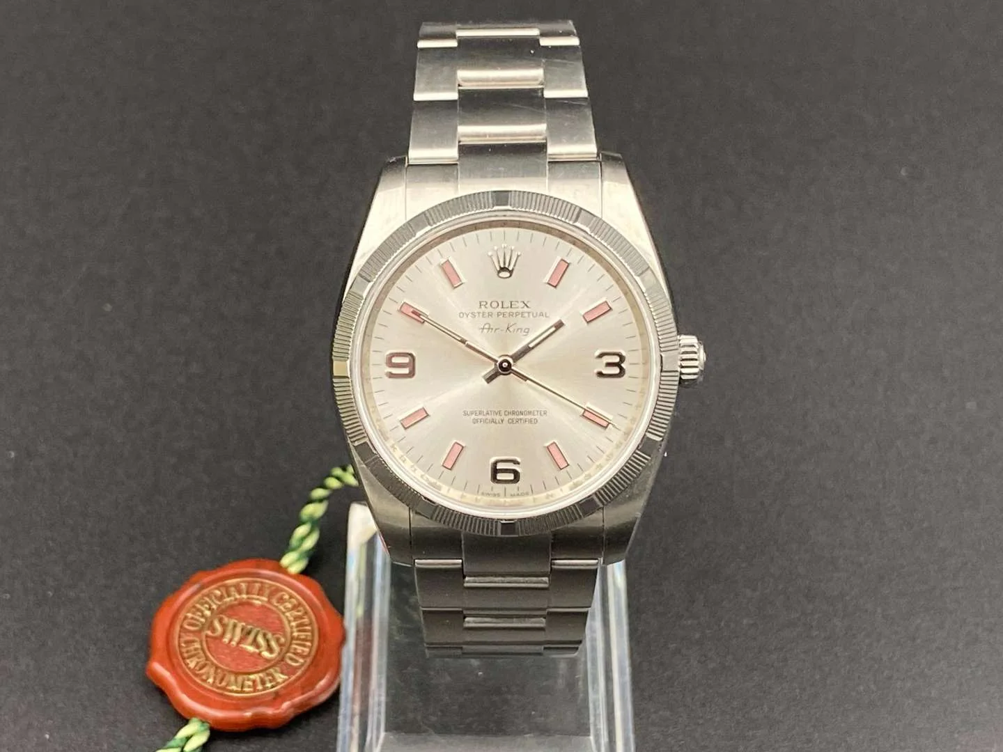 Silvered 114210 dial with rose-colored 3-6-9 numerals and baton markers