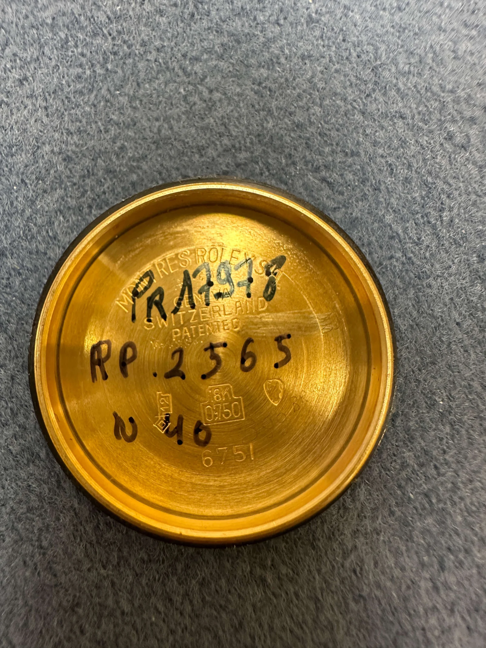 Inner yellow-gold Rolex caseback stamped 6751
