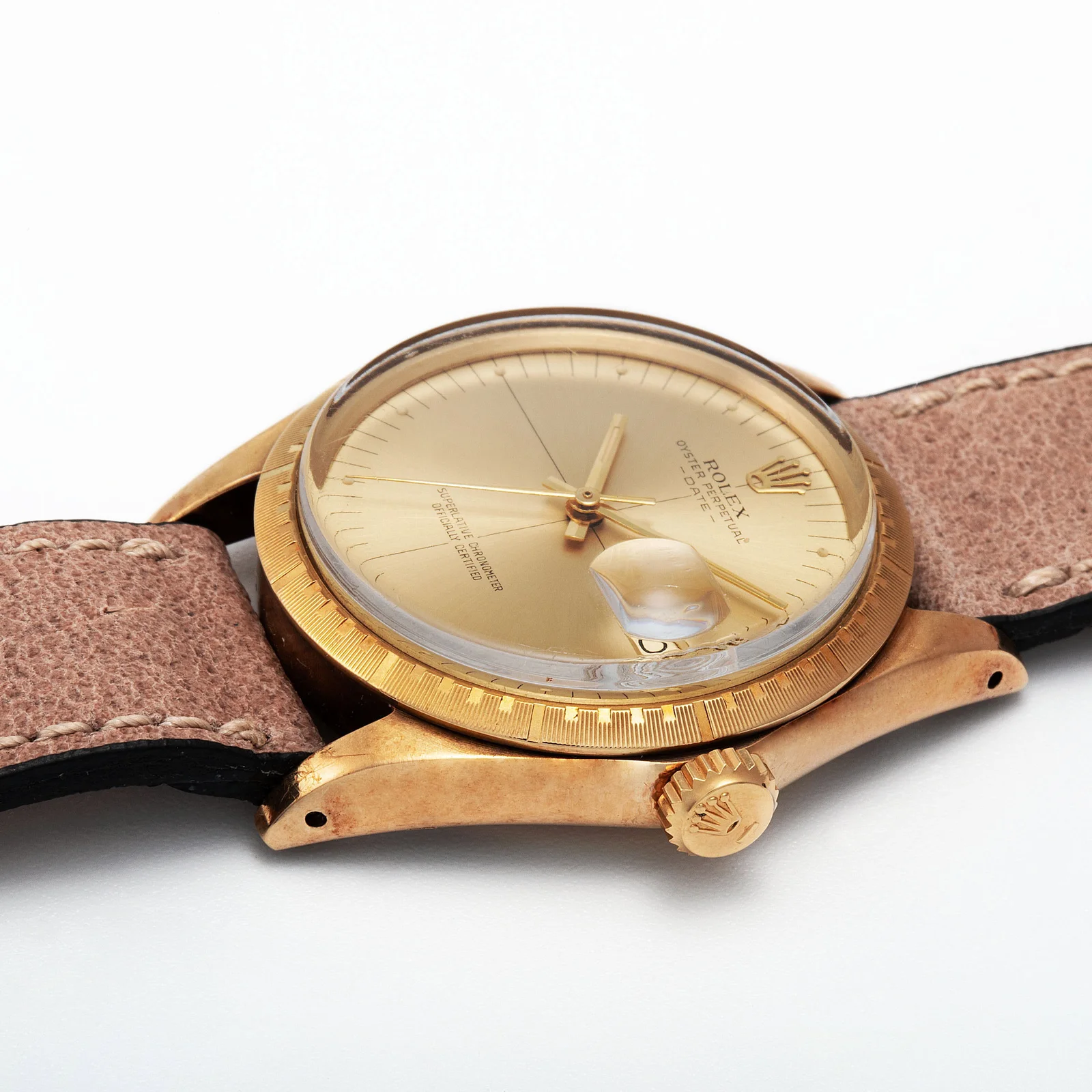 Angled view of the patterned bezel, acrylic crystal, lugs and screw-down crown on Rolex ref. 1512