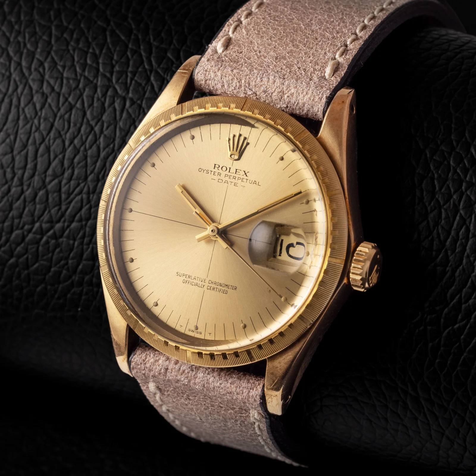 Close view of the champagne crosshair dial, applied markers, date and Cyclops on Rolex ref. 1512