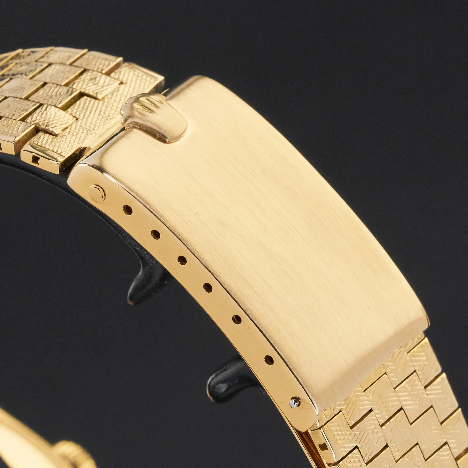 Gold clasp on the bracelet shown with the Rolex Oyster Perpetual Date listed as ref. 1502