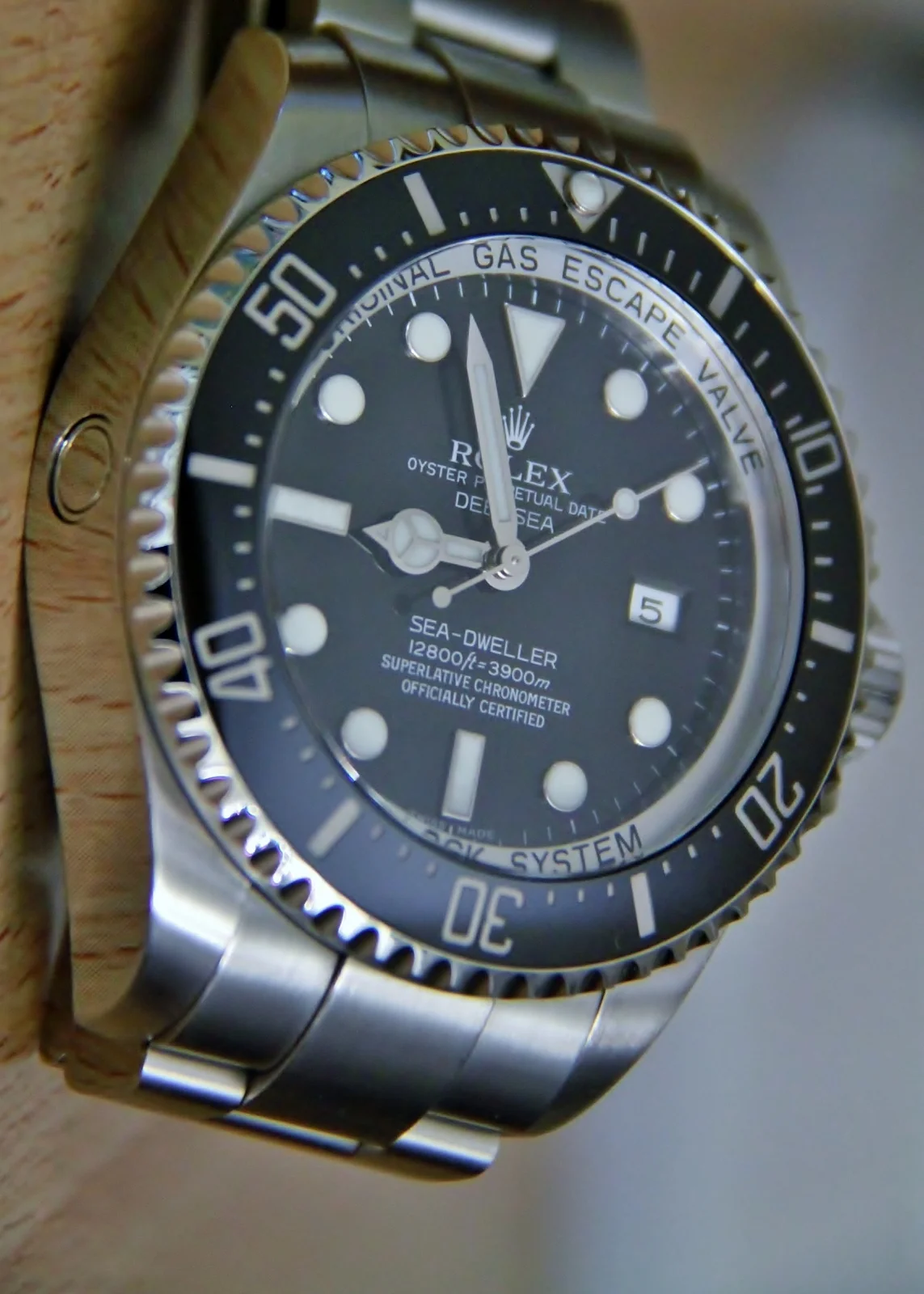 Oblique view of the black dial on a Rolex Deepsea 116660