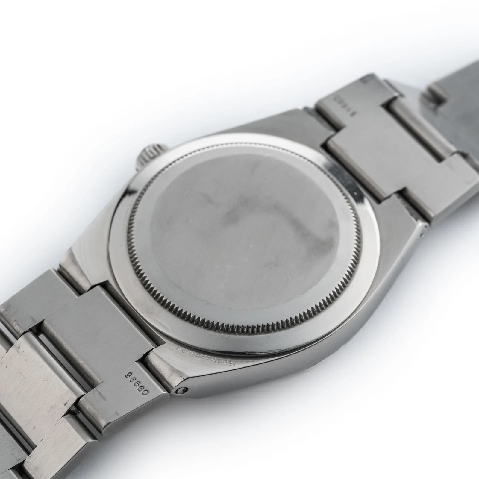 Caseback and bracelet-end stamp, same watch