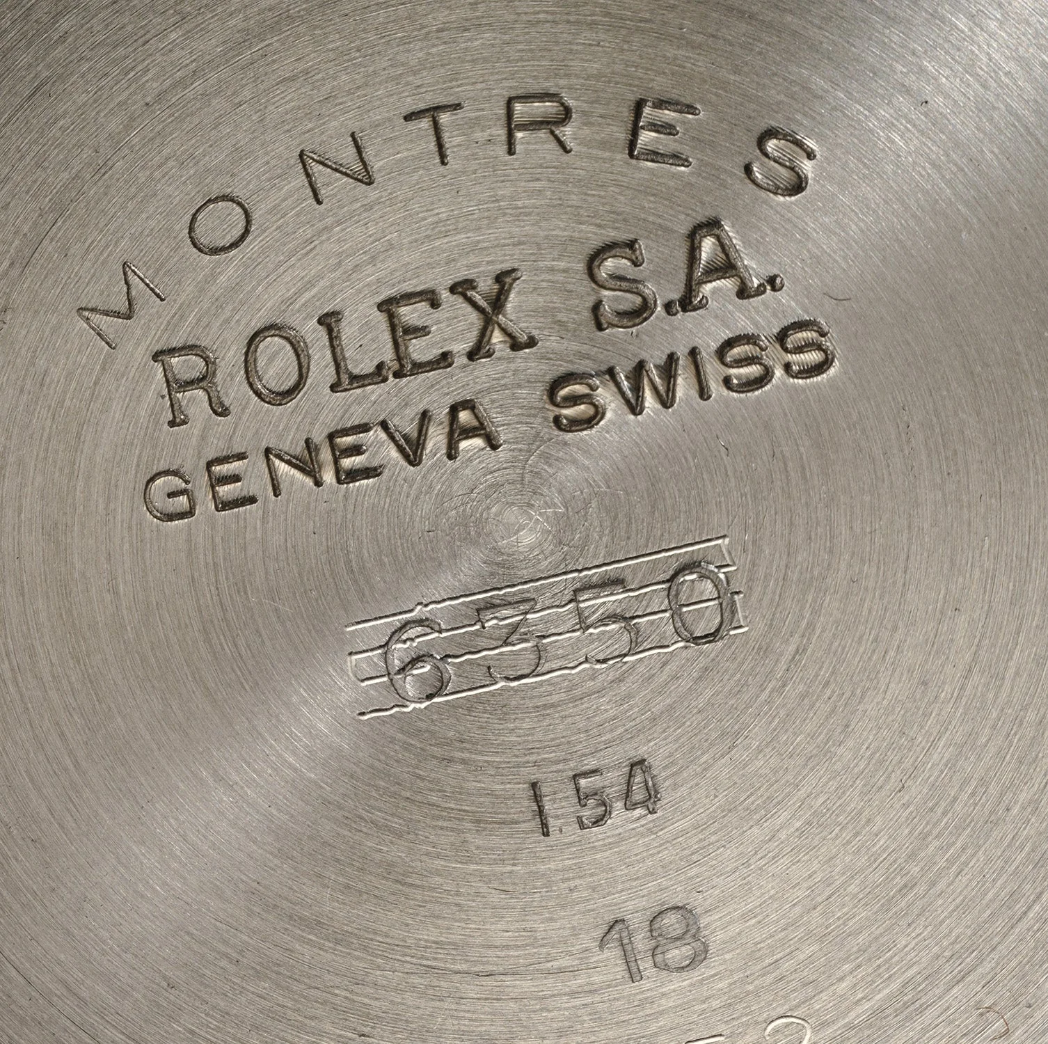 Inside caseback of Rolex 6352 case 28,524 showing 6350 struck through and 6352 stamped beside it